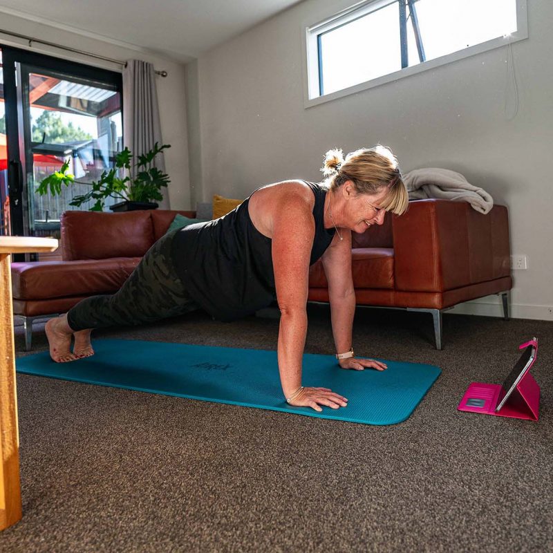 Women stretching out in online session